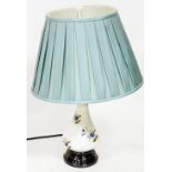 A pottery table lamp, with turquoise material shade on a metal base, 68cm high.