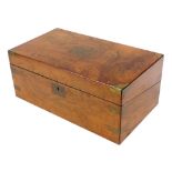 A 19thC walnut and brass bound writing box, the top with a vacant cartouche, the hinged lid revealin