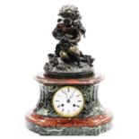 A 19thC French marble and bronze mantel clock, the top with a bronze figure of a cherub holding rose