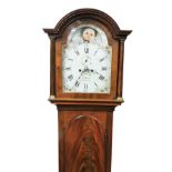 W. Hough, Portsmouth. A 19thC flame mahogany long case clock, with an arched moon phase dial, decora