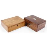 A Victorian rosewood work box, the top with a mother of pearl vacant panel, the hinged lid enclosing