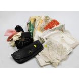 A quantity of 20thC linen, lace trimmed linen, some worked, a ladies leather clutch bag, etc. (a qua
