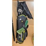 A Dunlop canvas golf bag, containing various golf clubs.