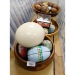 Various carved eggs, treen, marble, an ostrich egg, carved treen bowls. (a quantity)