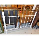 A white painted metal and brass double headboard.