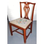 A Georgian mahogany dining chair, with a pierced back and embroidered drop in seat. Lots 1501 to 157