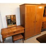 A mid 20thC Stag double wardrobe and associated mirror back dressing table, with stool. The upholst