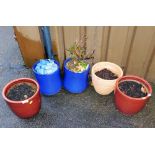 A quantity of garden pots, some in blue glazes, terracotta example, various sizes.