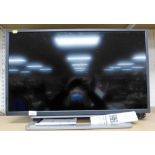 A Toshiba 31'' flat screen television, with lead and remote.