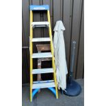 A Werner A frame step ladder, a further wooden step ladder, and a garden parasol.