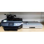 A Hewlett-Packard HP Officejet printer, 5740, and a Samsung VCR and DVD player.