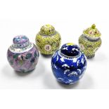 Four Chinese porcelain jars and covers, to include a blue and white example decorated with prunus bl