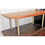 A mid 20thC teak coffee table, on four stainless steel supports, the top 91cm x 50cm. Lots 1501 to
