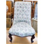 A Victorian mahogany nursing chair, with an upholstered button back and seat on carved legs, with ca