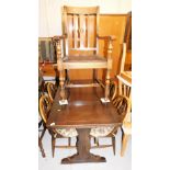 A drawer dining table, on trestle base, 73cm high, the top 113cm x 71cm, four Ercol chairs, with Pri