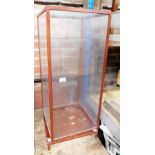 A hardwood framed display case, with four sectional glass panels, 92cm high.