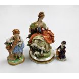 A Capodimonte porcelain figure of a lady and birds, on a circular gilt highlighted base, 20cm high,