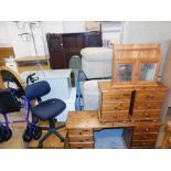 A group of furniture, to include a wicker tub chair, cheval mirror, a pair of pine three drawer ches