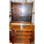 Three various bookcases, each with sliding glass doors.