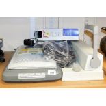 A HB Scanjet, 3970, and a Rexel binding machine, CB2000, with various binding combs.
