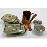 A collection of pottery, two Staffordshire Prattware pot lids, one depicting The Village Wedding, an