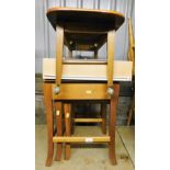 A nest of three mid 20thC teak tables, rectangular top coffee table on castors, etc. (a quantity)