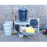 A garden glass top table, and three associated chairs, plastic garden bin, various brushes, wheelbar