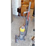 A Dyson DC40 upright vacuum cleaner.