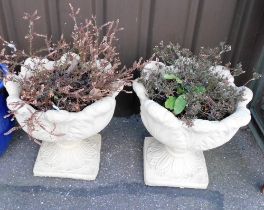 A pair of painted concrete stone planters, with shaped rims, the bodies decorated with leaves, on sq