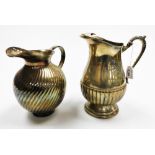 Two early 20thC silver plated jugs, the first with acanthus leaf handle and part gadrooned body, a s