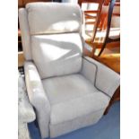 An electric reclining armchair, upholstered in beige fabric. Lots 1501 to 1571 are available to vie