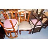 A collection of chairs, to include a pair of oak carved back dining chairs with overstuffed seats, e