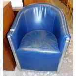 A faux leather tub chair, with chrome supports.