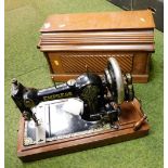 A cased Empress sewing machine.