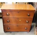 A Victorian mahogany three drawer chest, with turned wooden handles on bun feet, 74cm high, 82cm wid
