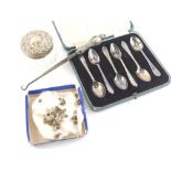 A set of six George V silver teaspoons, with shaped handles, 9cm wide, (cased), a cut glass dressing