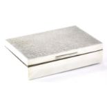 An Elizabeth II silver cigarette box, with raised lid, thumb mould handle and cedar lined interior,