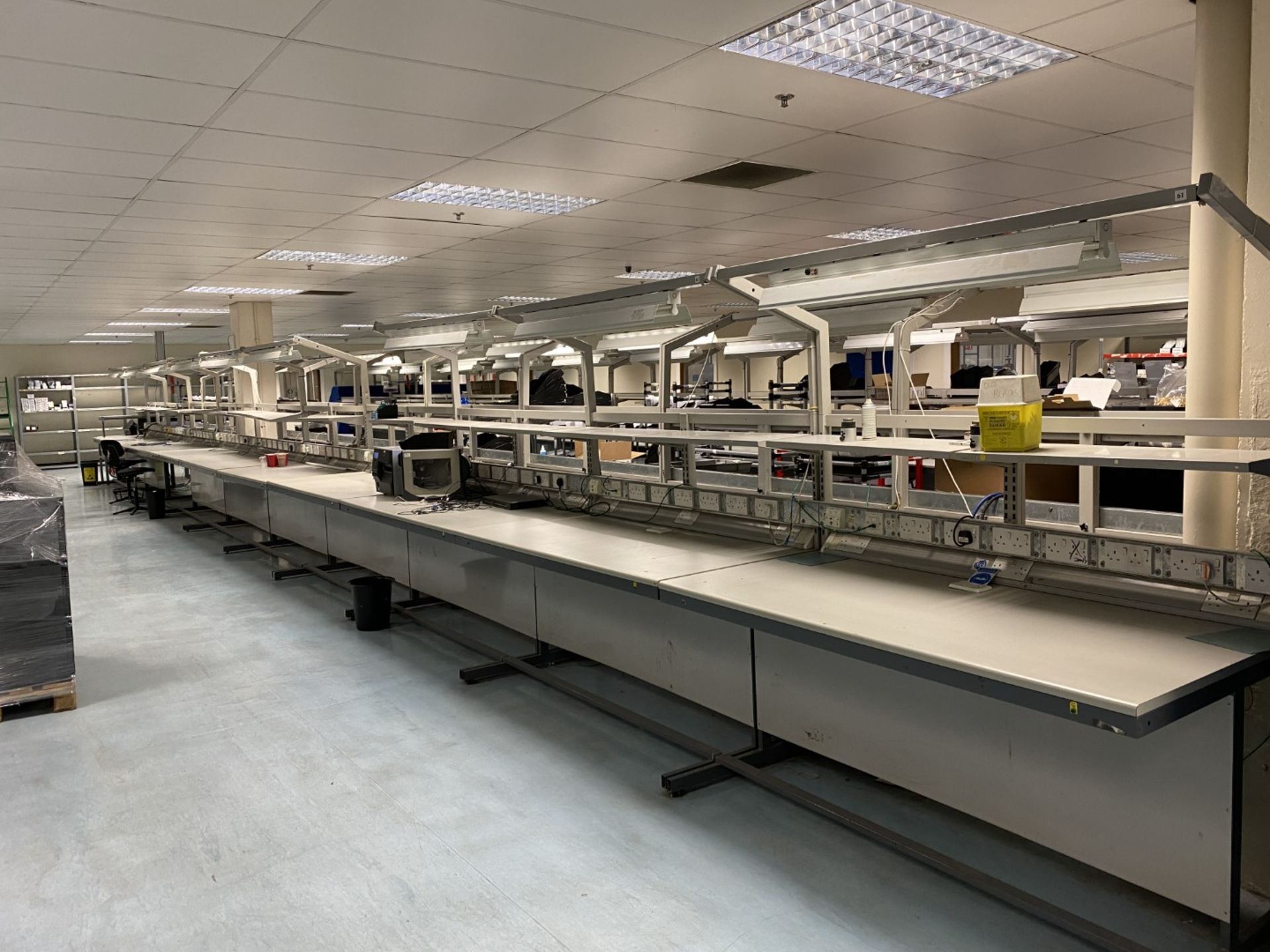 5x Work benches with trunking power sockets, shelving and overhead lighting, grey metal frame