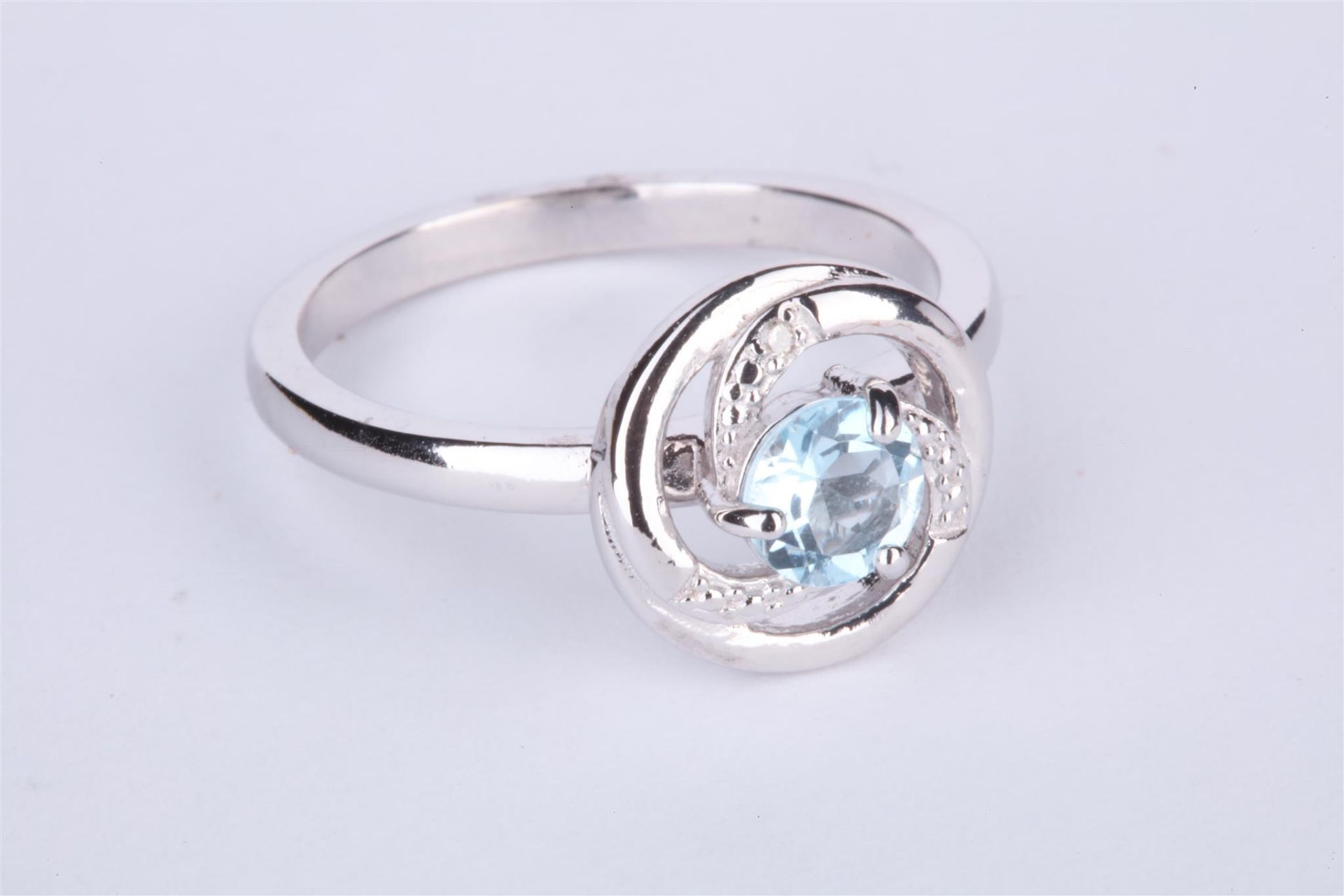 + VAT Ladies Silver Aquamarine and Diamond Circular Ring - Central Aquamarine With Swirl Design