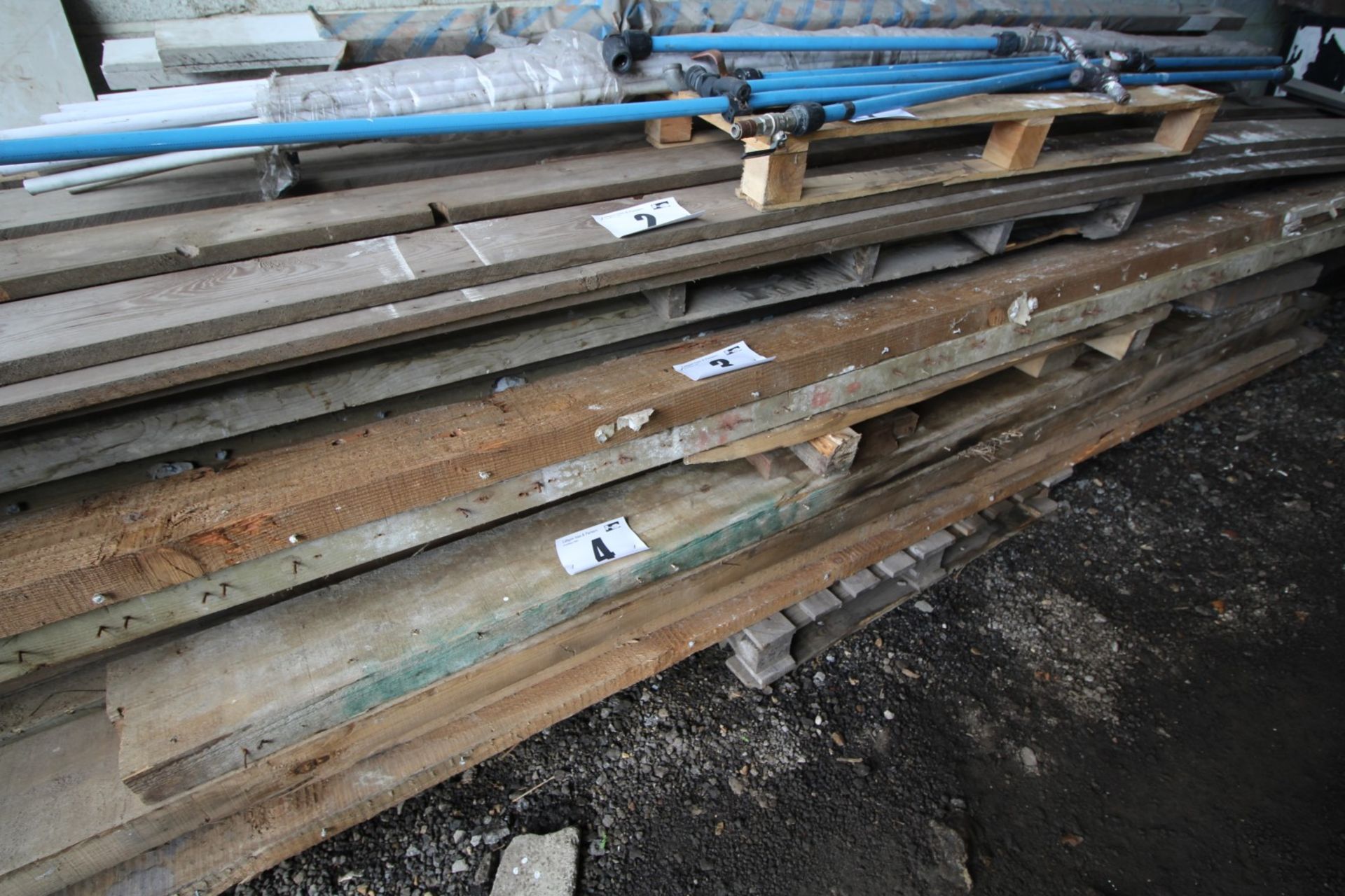 CONTENTS ON BOTTOM OF SOFTWOOD TIMBER BEAMS, 9" x APPROXIMATELY 15'. FORKLIFT CHARGE £5