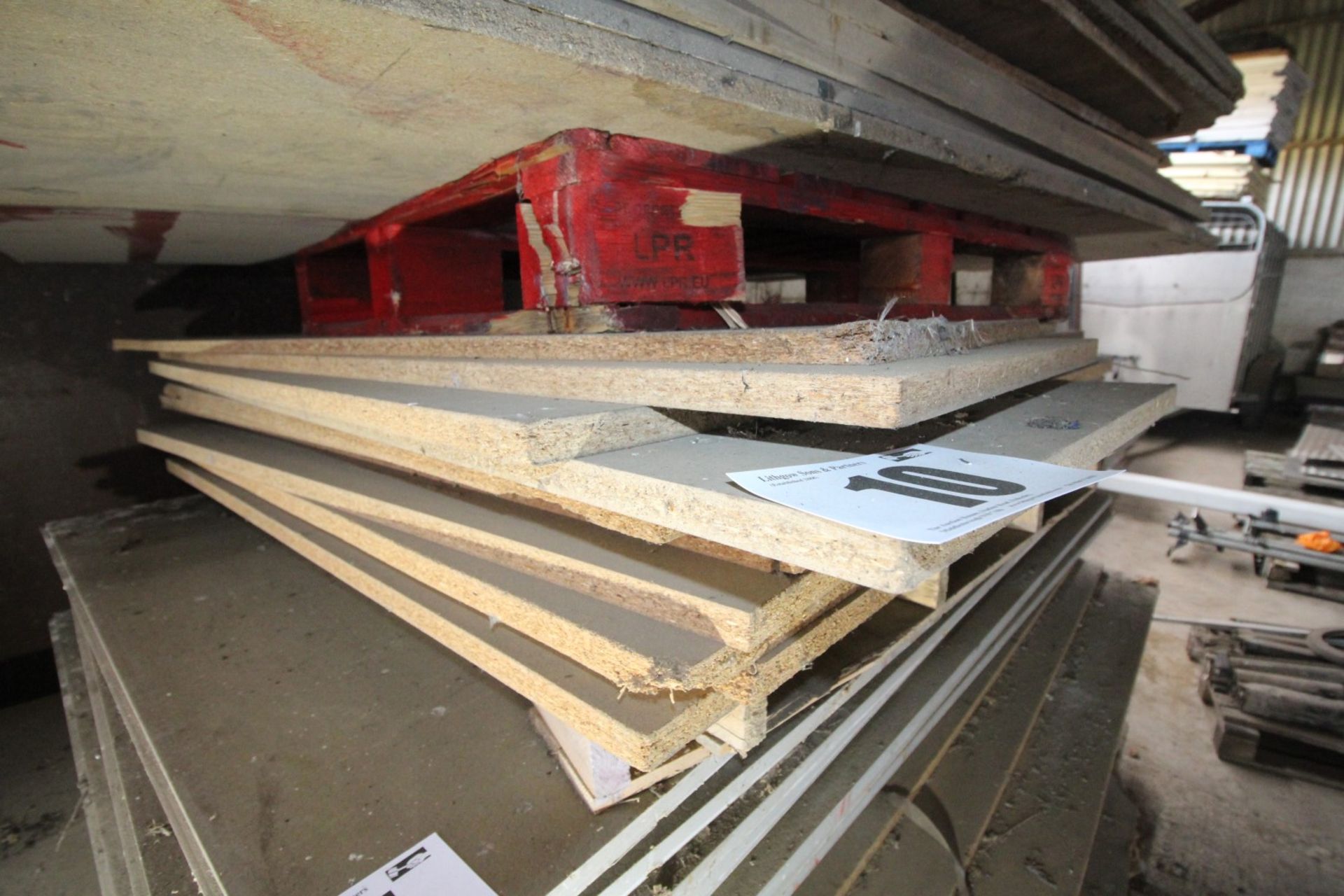 CONTENTS ON PALLET OF CHIPBOARD TIMBER SHEETING. FORKLIFT CHARGE £4