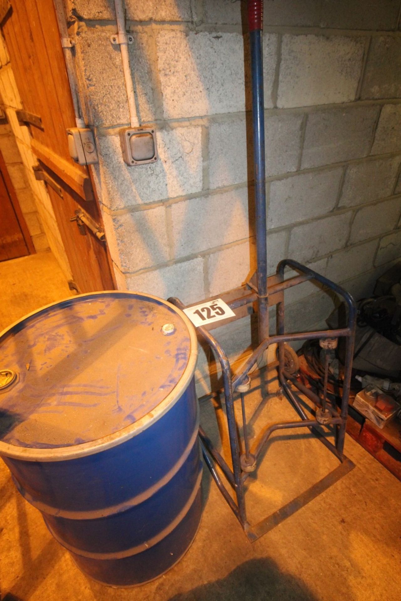 BLUE METAL FABRICATED HORIZONTAL 45 GALLON DRUM STAND ON CASTER AND EMPTY METAL DRUM