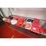 CONTENTS ON SHELF OF MANCHESTER UNITED SCARVES, MANCHESTER UNITED PLASTIC BAGS