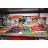 SHELF OF SPORTS BOOKS INCLUDING EAGLE ANNUAL, BOOK OF SOCCER, FOOTBALL STAR PARADE CIRCA 1970