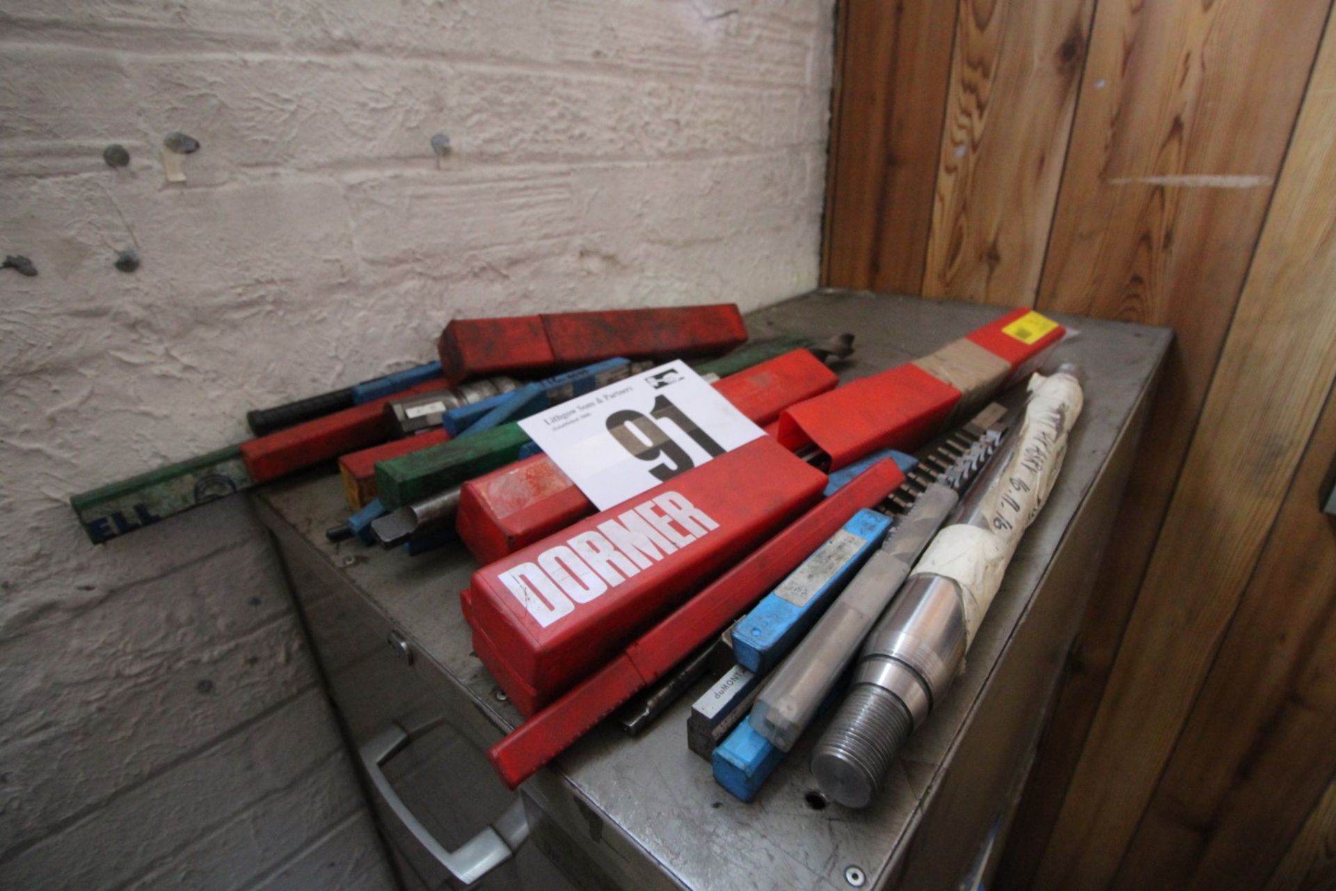 CONTENTS ON TOP OF CABINET OF CONSUMABLE DRILL BITS, ETC.