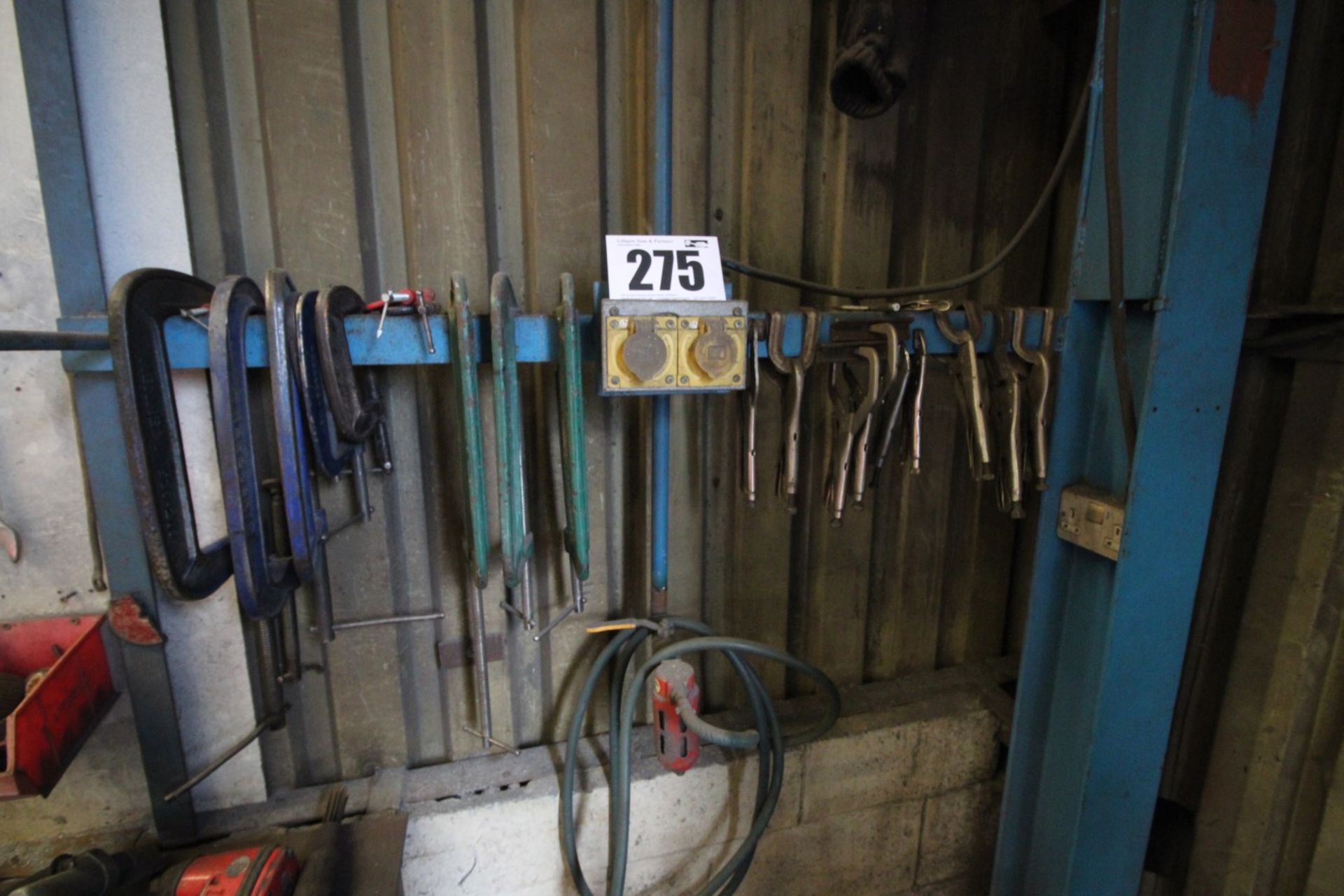 CONTENTS ON WALL OF 7 G-CLAMPS & APPROX. 9 WELDING CLAMPS