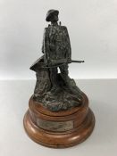 Bronzed figurine of a Soldier on a Mahogany Plinth with a Hallmarked silver Plaque which reads "