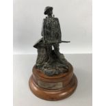 Bronzed figurine of a Soldier on a Mahogany Plinth with a Hallmarked silver Plaque which reads "