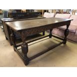 Medium sized three plank oak refectory table with pegged breadboard ends and carved legs and