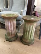 Two terracotta statue or plant stands with signs of age